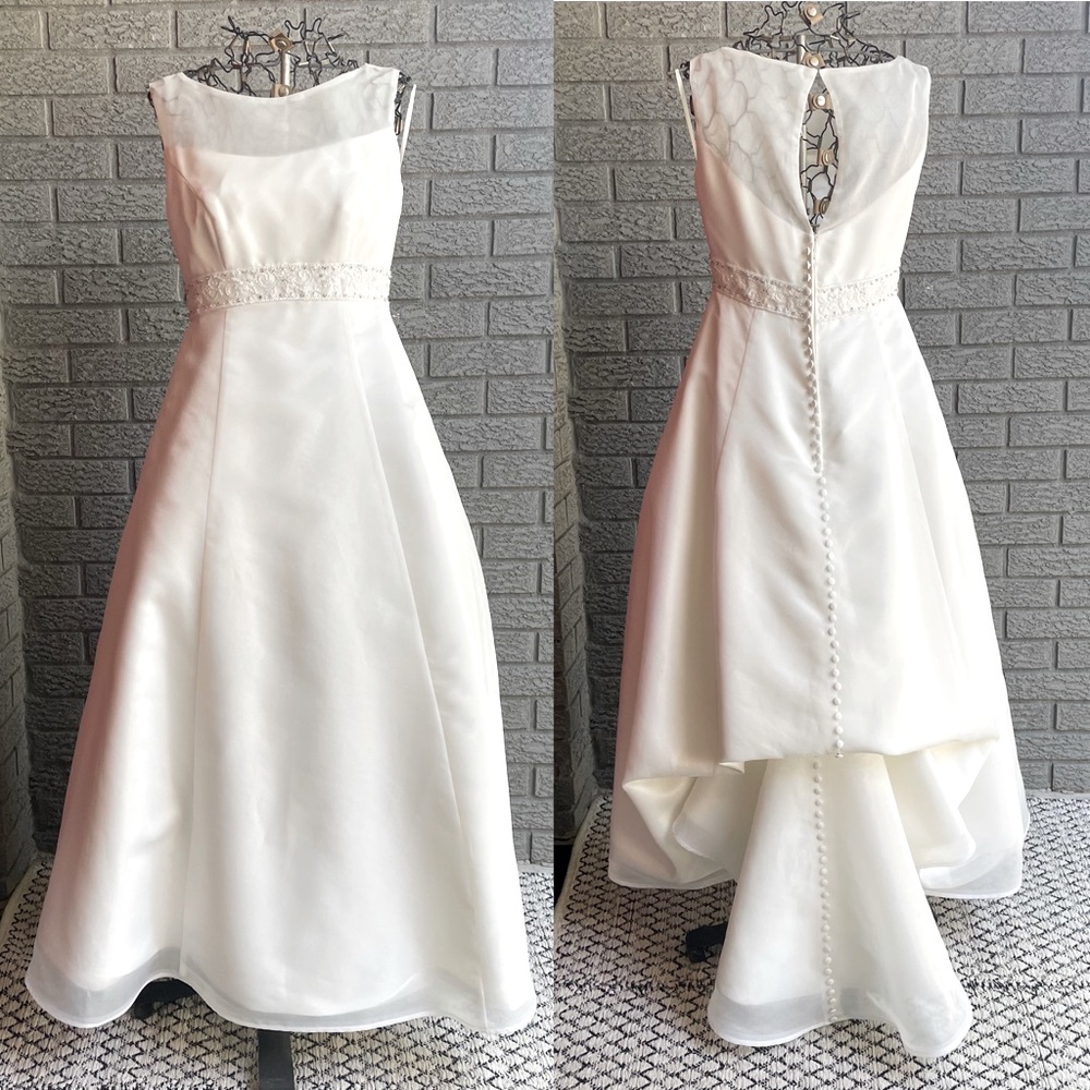 Classic contemporary white chiffon wedding dress with beaded empire waistline.